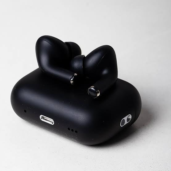 Black wireless earbuds with a bow design in an open case on a light gray background
